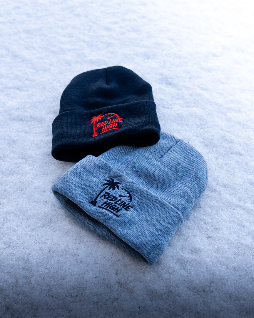 Two Red Line High winter toques side by side, showcasing the black and grey sherpa-lined styles.